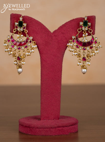 Jadau earrings with kemp jadau kundan stones and pearl hangings