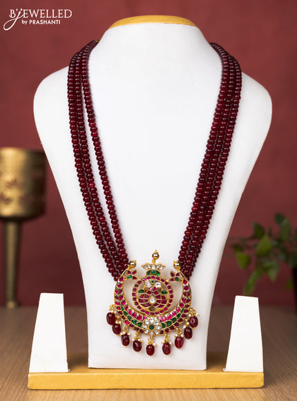 Jadau beaded maroon haaram chandbali pendant with jadau kundan stones and pearl & beads hanging without earrings