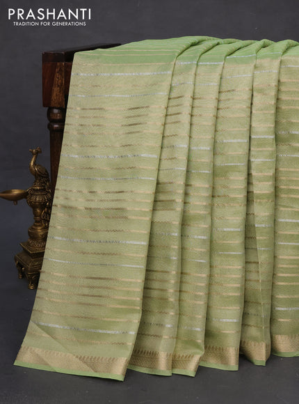 Tissue silk saree pista green with allover silver & zari weaves and zari woven border