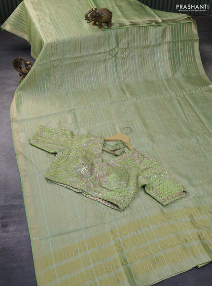 Tissue silk saree pista green with allover silver & zari weaves and zari woven border