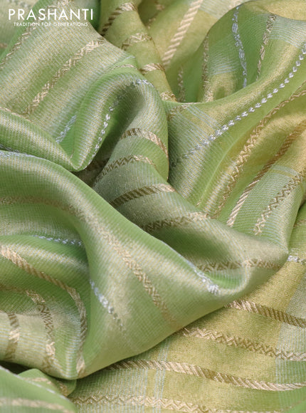 Tissue silk saree pista green with allover silver & zari weaves and zari woven border