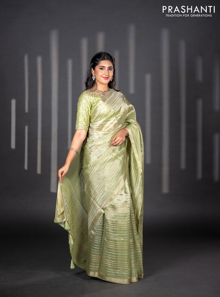 Tissue silk saree pista green with allover silver & zari weaves and zari woven border