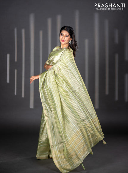 Tissue silk saree pista green with allover silver & zari weaves and zari woven border