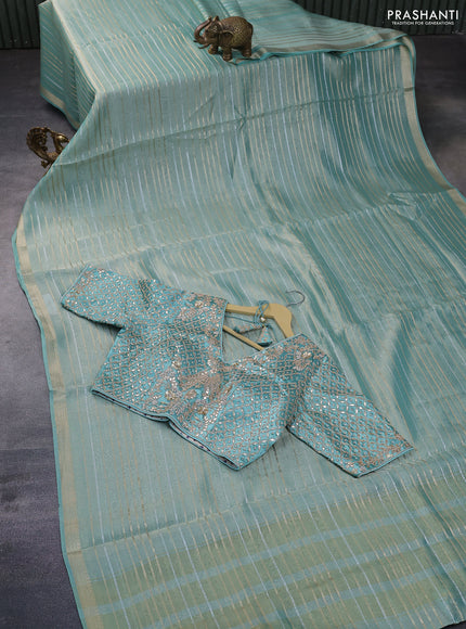 Tissue silk saree teal shade with allover silver & zari weaves and zari woven border