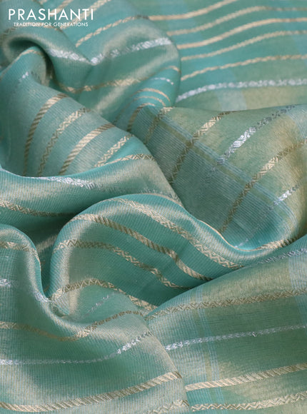 Tissue silk saree teal shade with allover silver & zari weaves and zari woven border