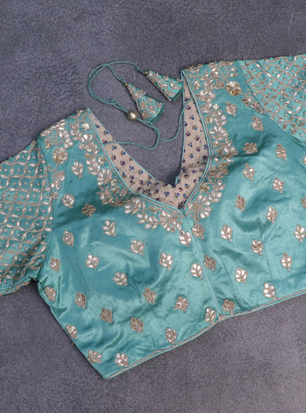 Tissue silk saree teal shade with allover silver & zari weaves and zari woven border