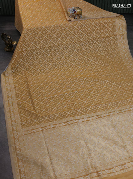 Banarasi silk cotton saree sandal with allover zari weaves and thread & zari woven border
