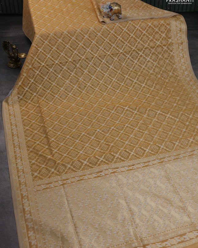 Banarasi silk cotton saree sandal with allover zari weaves and thread & zari woven border