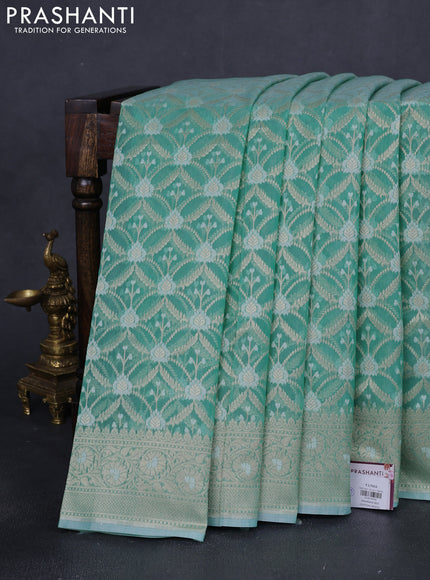 Banarasi silk cotton saree teal shade with allover zari weaves and zari woven border