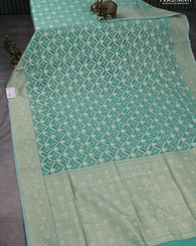 Banarasi silk cotton saree teal shade with allover zari weaves and zari woven border