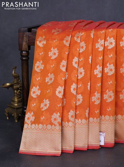 Banarasi silk cotton saree orange with allover floral zari woven buttas and zari woven border