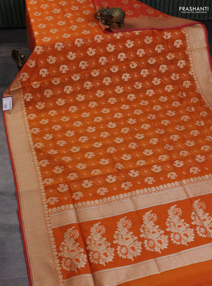 Banarasi silk cotton saree orange with allover floral zari woven buttas and zari woven border