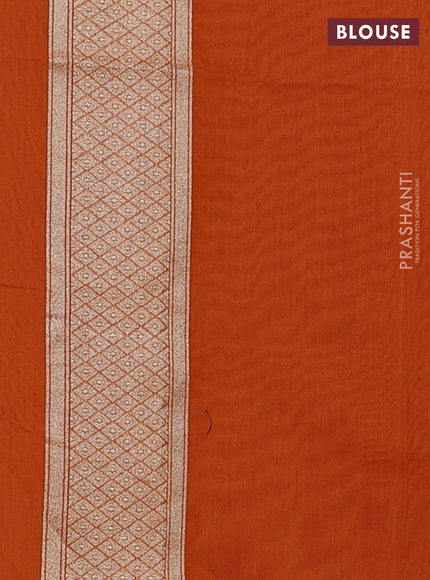 Banarasi silk cotton saree orange with allover floral zari woven buttas and zari woven border