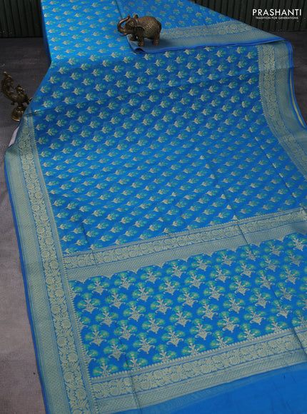 Banarasi silk cotton saree cs blue with allover floral thread & zari woven buttas and zari woven border