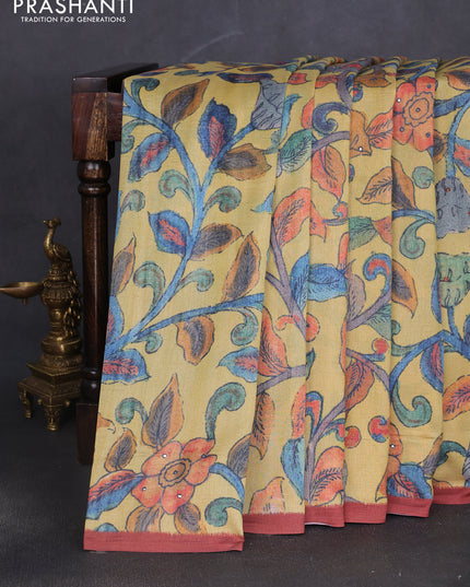 Semi tussar saree yellow and rust shade with allover kalamkari prints and mirror work