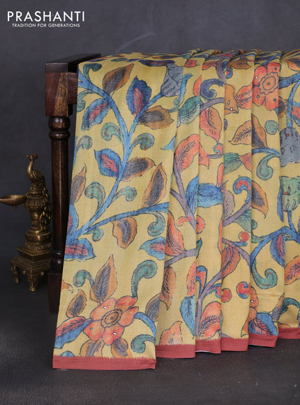 Semi tussar saree yellow and rust shade with allover kalamkari prints and mirror work