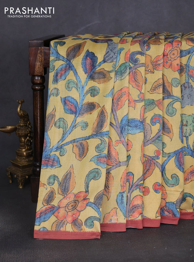 Semi tussar saree yellow and rust shade with allover kalamkari prints and mirror work