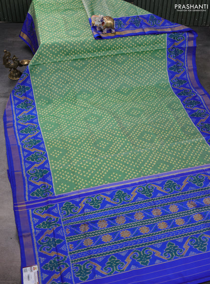 Rajkot patola silk saree green and royal blue with allover ikat weaves and ikat woven zari border
