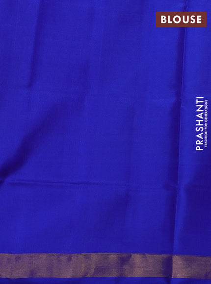 Rajkot patola silk saree green and royal blue with allover ikat weaves and ikat woven zari border