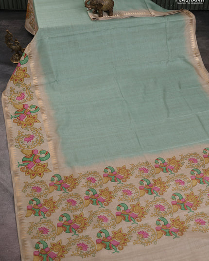 Art tussar saree pastel green and beige with plain body and tanjore printed border