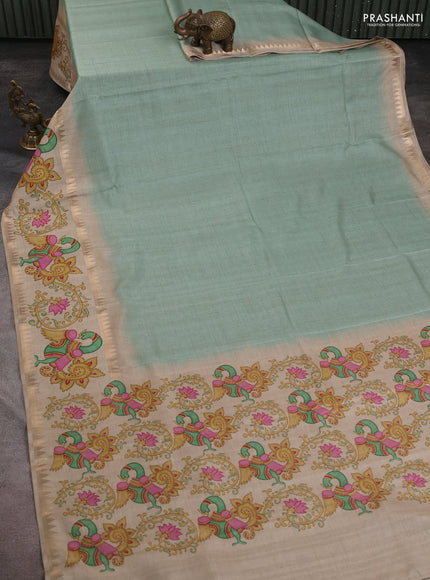 Art tussar saree pastel green and beige with plain body and tanjore printed border