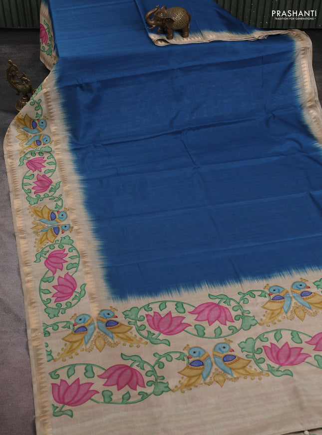 Art tussar saree peacock blue and beige with plain body and tanjore printed border