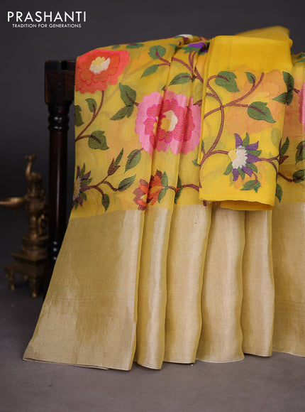 Organza silk saree yellow with allover floral embroidery work and long zari woven border