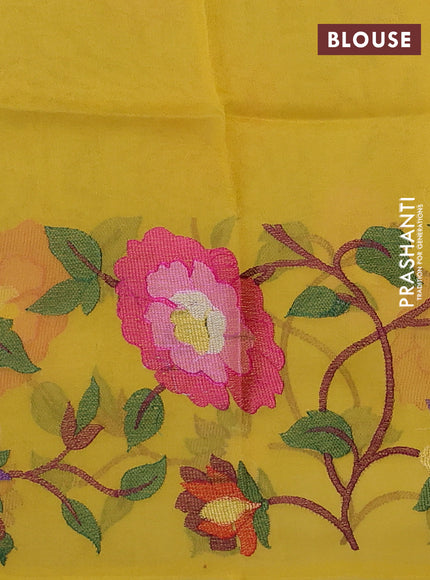 Organza silk saree yellow with allover floral embroidery work and long zari woven border