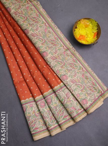 Semi tussar saree rust shade and cream with allover bandhani prints and madhubani printed pallu & border