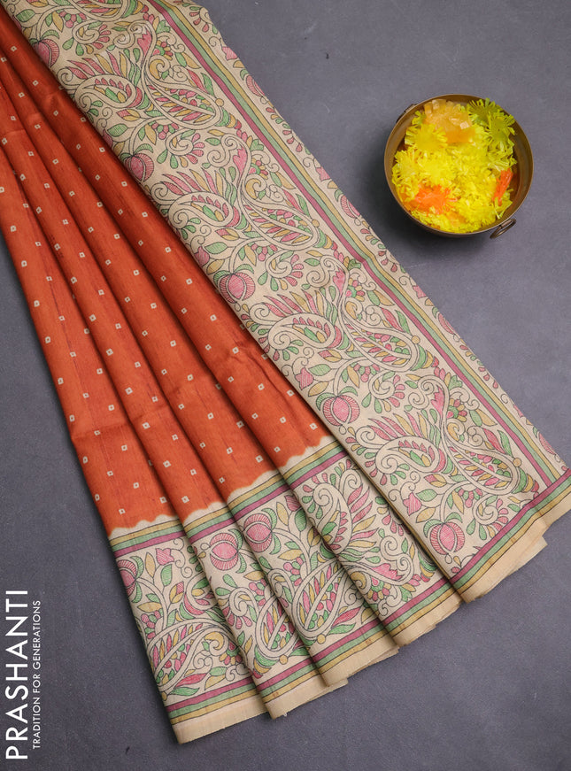 Semi tussar saree rust shade and cream with allover bandhani prints and madhubani printed pallu & border