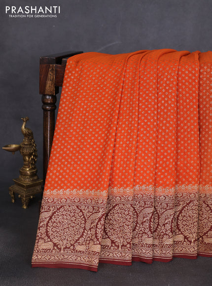 Banarasi georgette saree orange and deep maroon with allover thread & zari woven buttas and long woven border