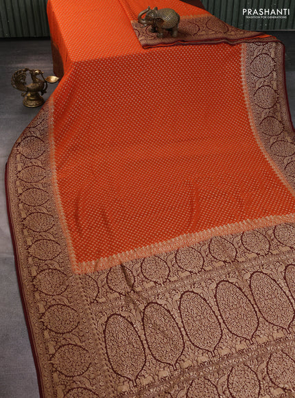 Banarasi georgette saree orange and deep maroon with allover thread & zari woven buttas and long woven border