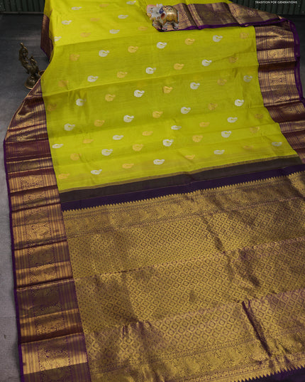 Kora kanchipuram silk saree lime yellow and purple with silver & gold zari woven buttas and annam zari woven border