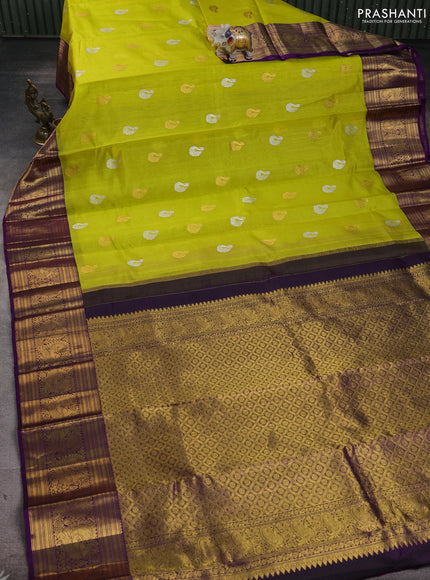 Kora kanchipuram silk saree lime yellow and purple with silver & gold zari woven buttas and annam zari woven border
