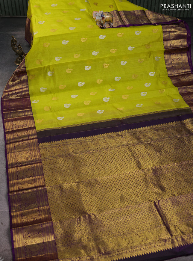 Kora kanchipuram silk saree lime yellow and purple with silver & gold zari woven buttas and annam zari woven border
