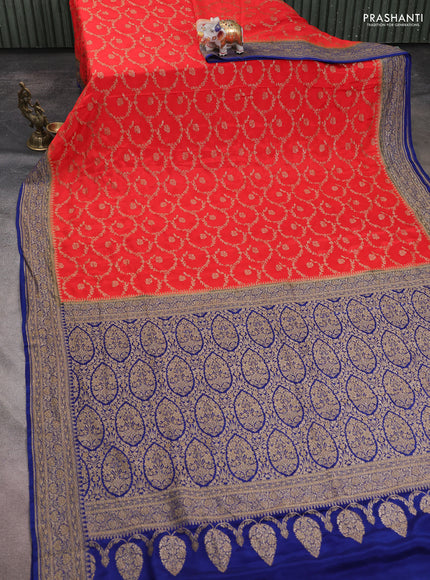 Banarasi crepe saree orange and dark blue with allover thread & zari weaves and woven border
