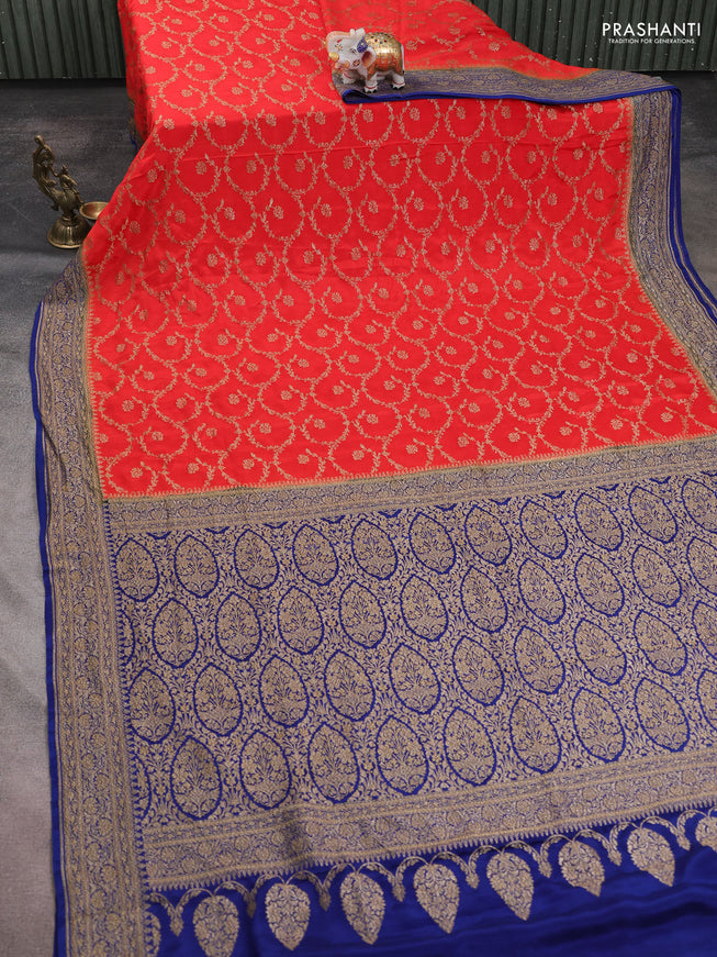 Banarasi crepe saree orange and dark blue with allover thread & zari weaves and woven border