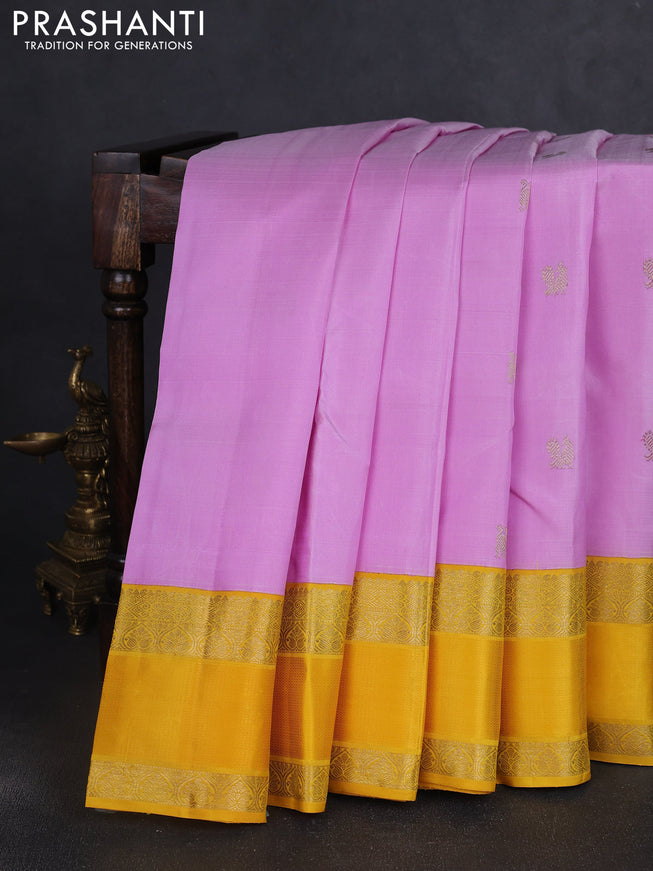 Pure kanchipuram silk saree mild lavender and yellow with zari woven buttas and rich zari woven korvai border