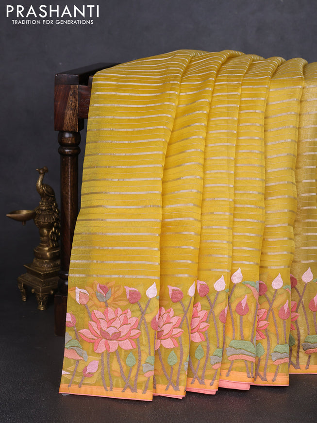 Pure organza silk saree yellow and peach shade with allover silver zari weaves and floral embroidery border