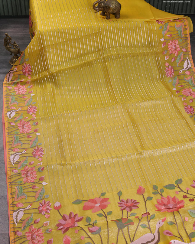 Pure organza silk saree yellow and peach shade with allover silver zari weaves and floral embroidery border