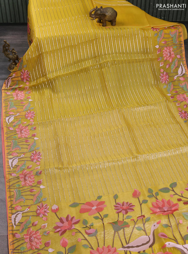 Pure organza silk saree yellow and peach shade with allover silver zari weaves and floral embroidery border