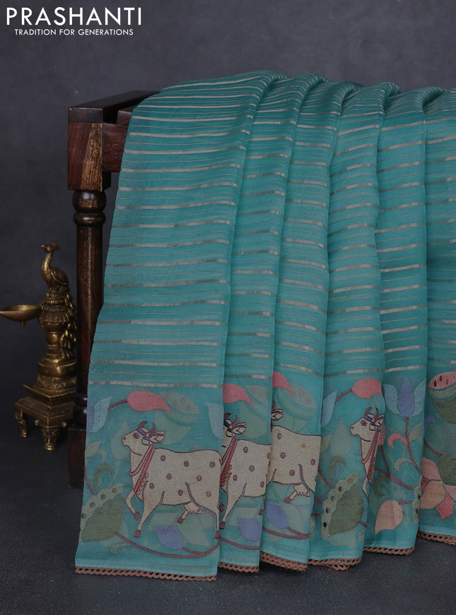 Pure organza silk saree teal green with allover silver zari weaves and pichwai embroidery border
