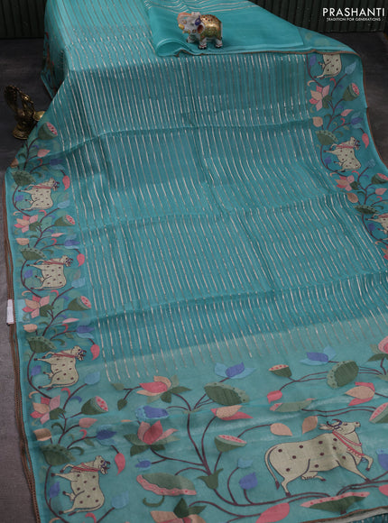 Pure organza silk saree teal green with allover silver zari weaves and pichwai embroidery border