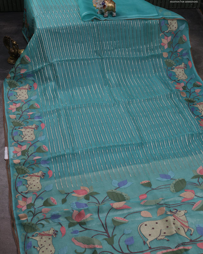 Pure organza silk saree teal green with allover silver zari weaves and pichwai embroidery border