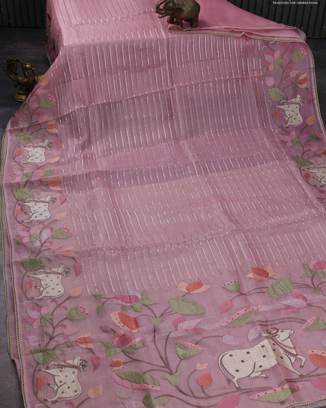 Pure organza silk saree peach shade with allover silver zari weaves and pichwai embroidery border