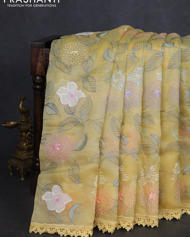 Pure organza silk saree pale yellow with allover applique work and lace work border