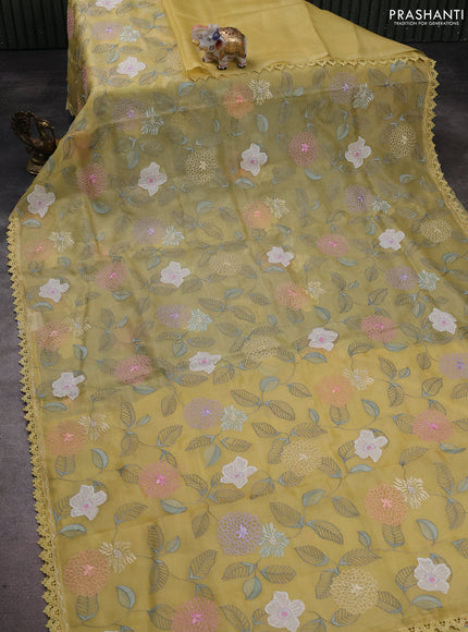Pure organza silk saree pale yellow with allover applique work and lace work border
