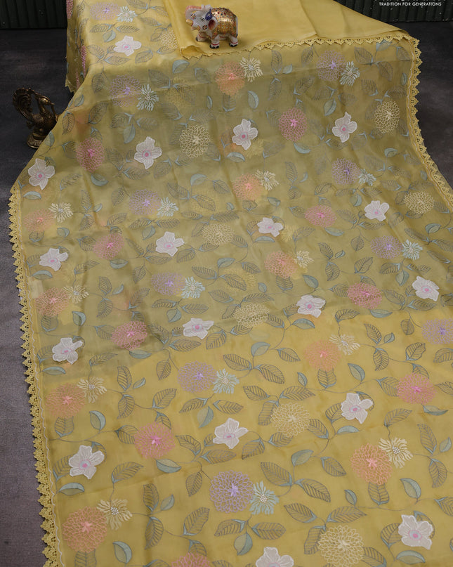 Pure organza silk saree pale yellow with allover applique work and lace work border