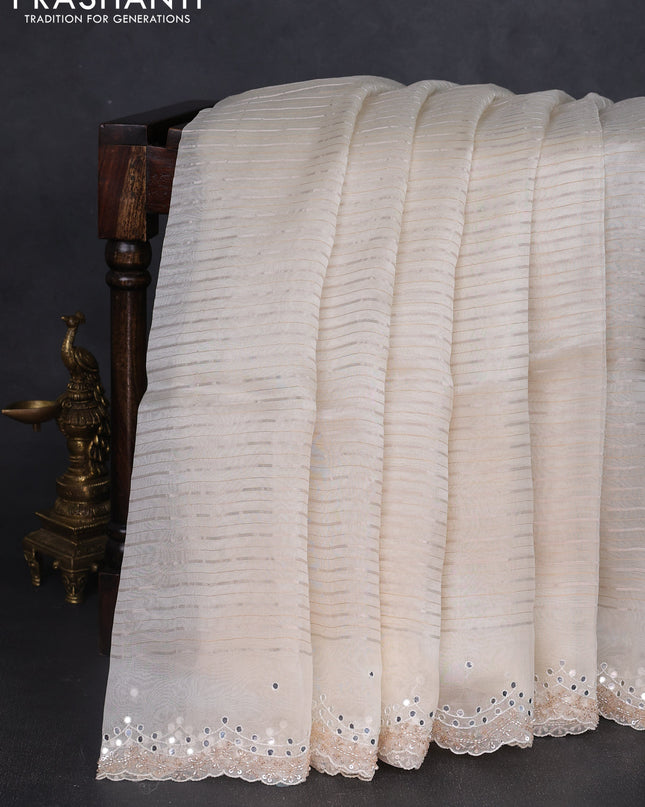 Pure organza silk saree off white with allover zari weaves and sequin mirror work border