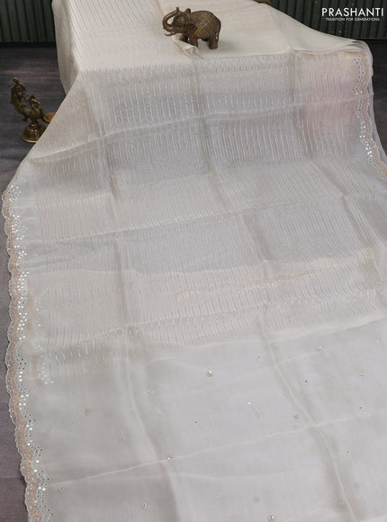 Pure organza silk saree off white with allover zari weaves and sequin mirror work border